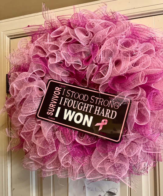 Someone gave Stacey Sims Turner this pink wreath after she spoke at a church about breast cancer. Her mother, Alease Sims, keeps the wreath up at her home as a reminder of Stacey's strength. "I see it every day. Every night,'' Alease said. "It motivates me. It motivated her.'' (Photo provided by Alease Sims