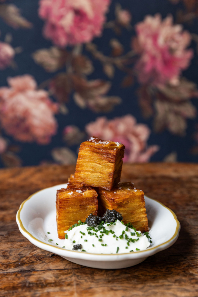 LaFete's Potato Pavé is made with thin layers of potato, fried until golden brown and served with housemade whipped Ranch. Caviar is an optional addition. (Photo by Caleb Chauncy)